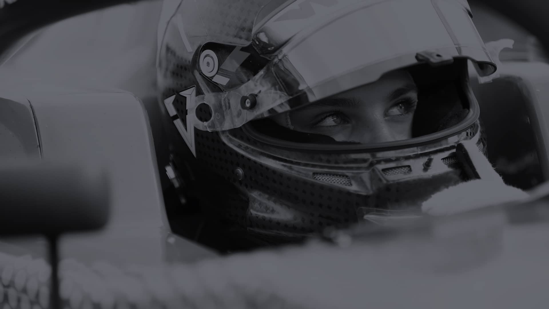 Close up of female racing driver in helmet