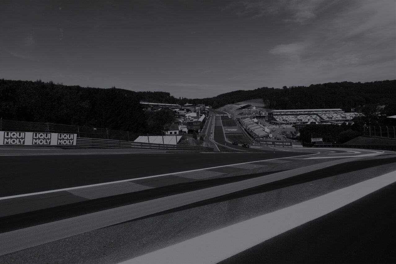 View of an F1 track with cars in the distance