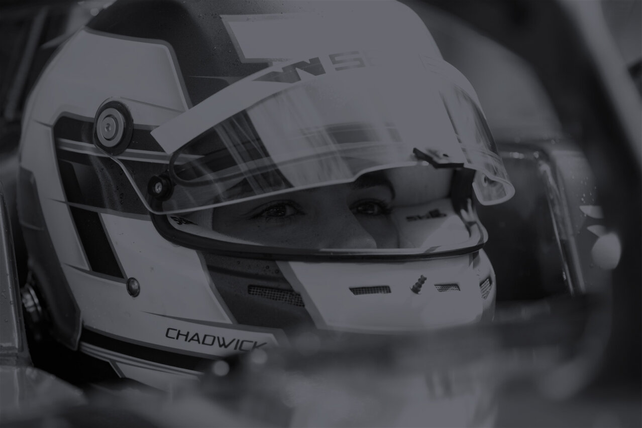 Close up of female racing driver in helmet